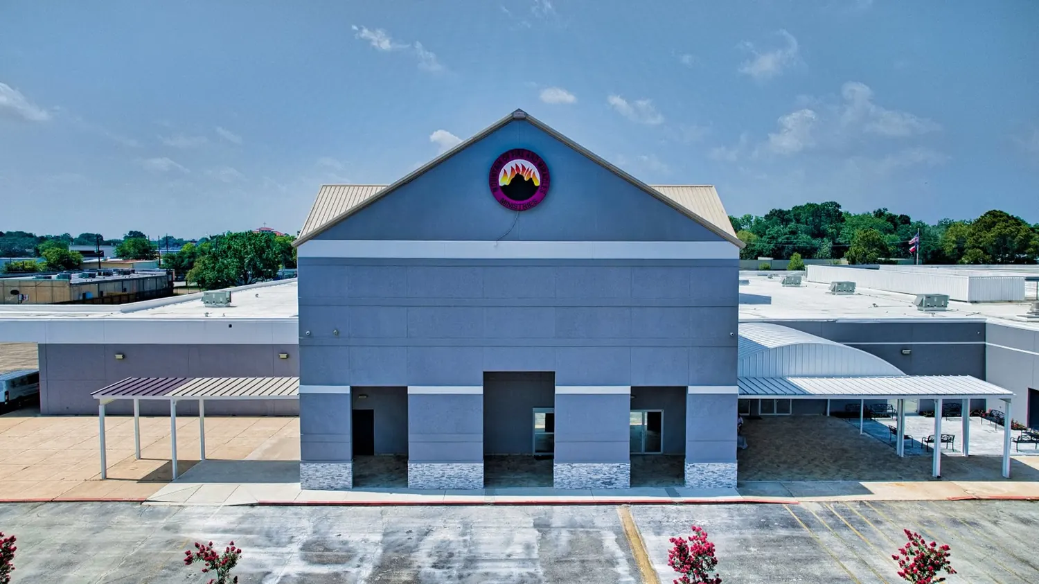 The MFM Mega Region 2 headquarters building exterior with the ministry emblem above the entrance